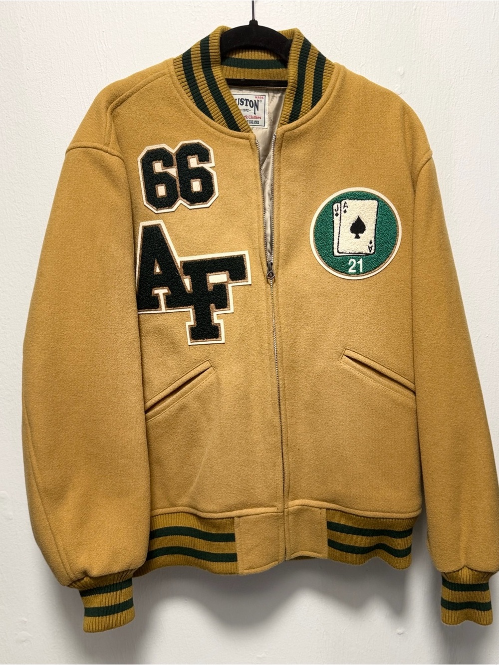 Houston brand Tan Varsity Puffer Jacket with Green Trim and Patch Details